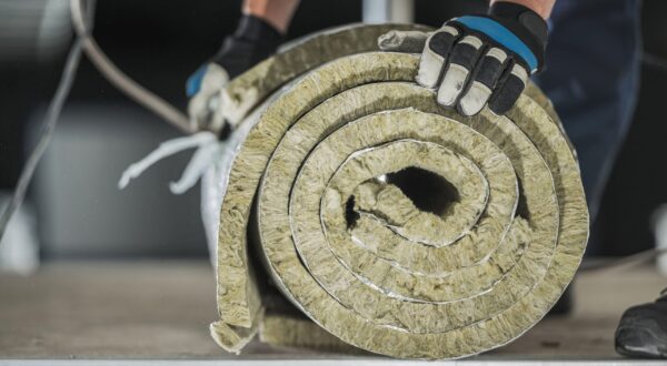 construction-worker-preparing-roll-of-mineral-wool-2025-03-15-00-55-15-utc-min
