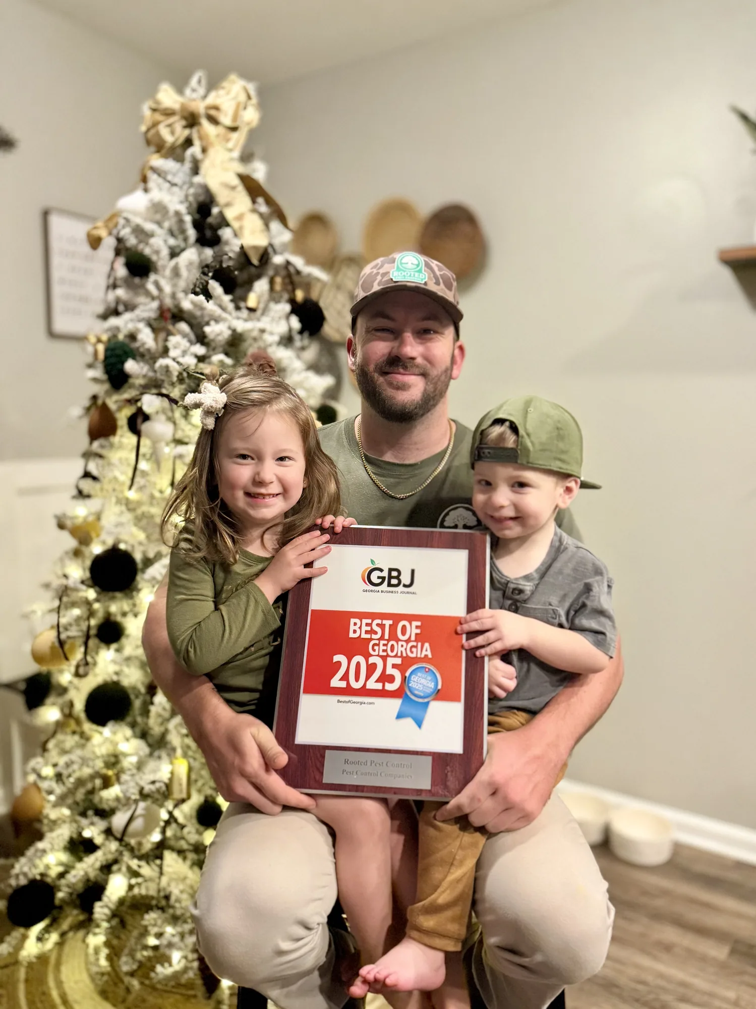 Zeke Gresham and his children with the Best of Georgia 2025 award