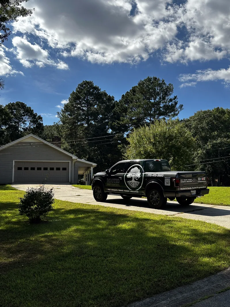 Rooted Pest Control truck in a West Georgia driveway